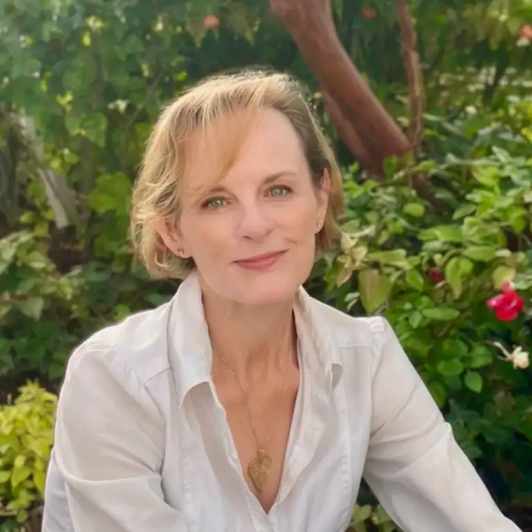 author Margo Graham, white woman smiling in a nature scene