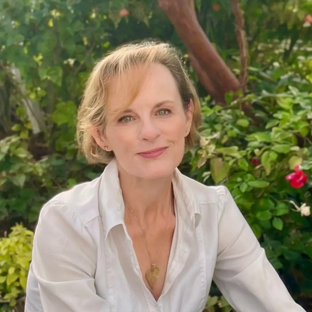 author Margo Graham, white woman smiling in a nature scene
